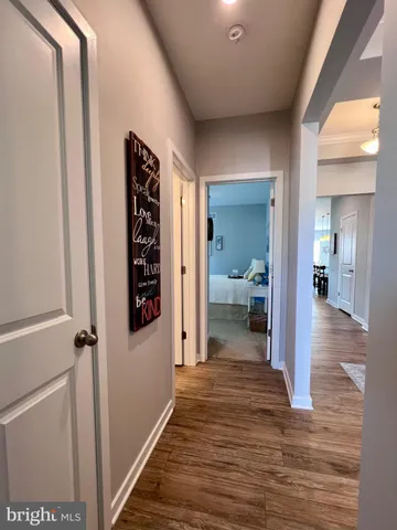 a kitchen with granite countertop a refrigerator stove and microwave