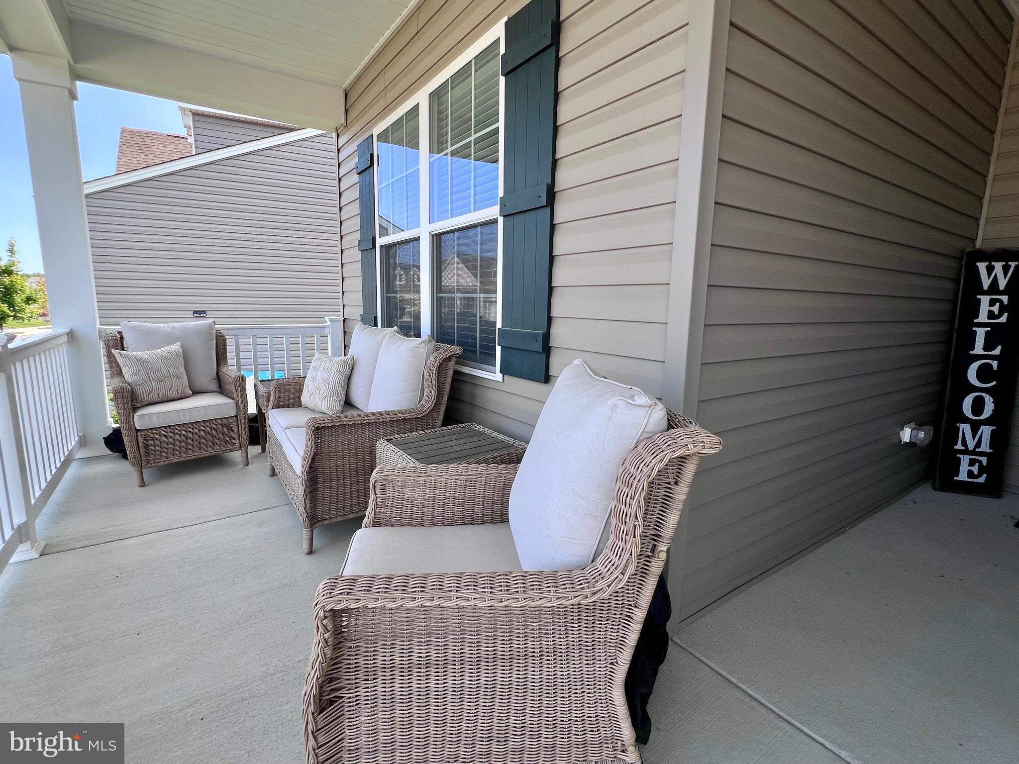 1143 Kayla Lane Townsend, DE 19734 - Photo 8 of 86 a view of backyard with seating space and wooden fence