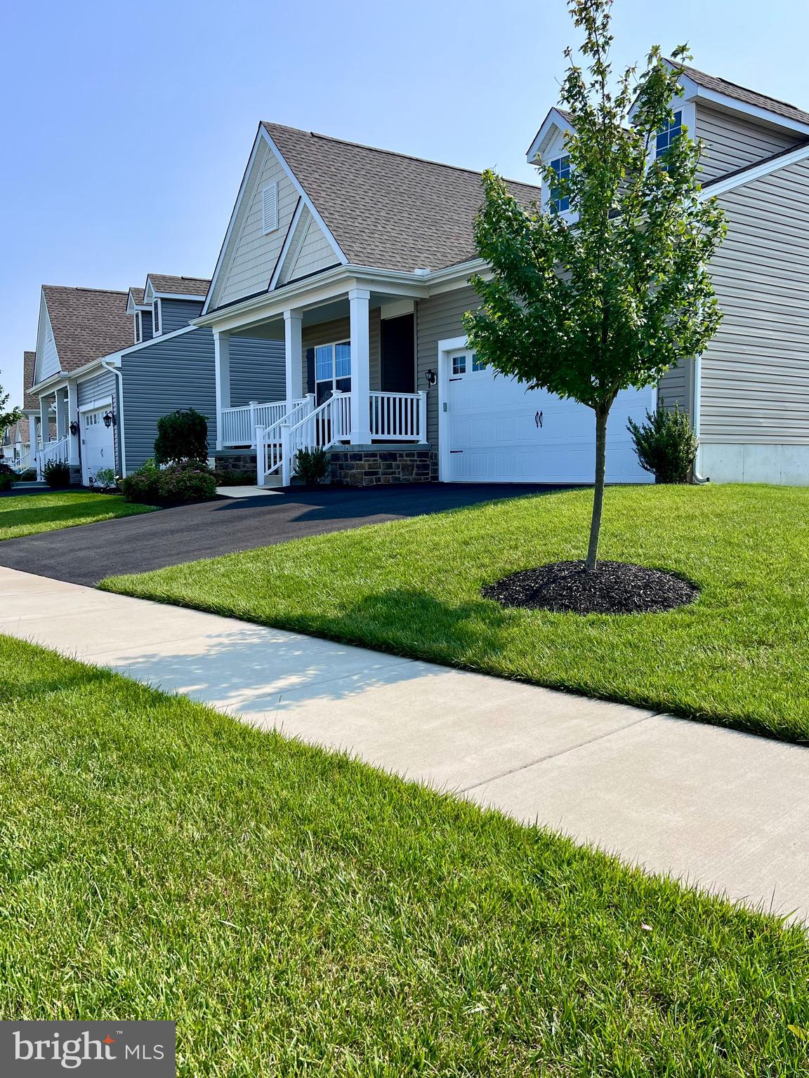 1143 Kayla Lane Townsend, DE 19734 - Photo 83 of 86 a front view of a house with a yard and garage