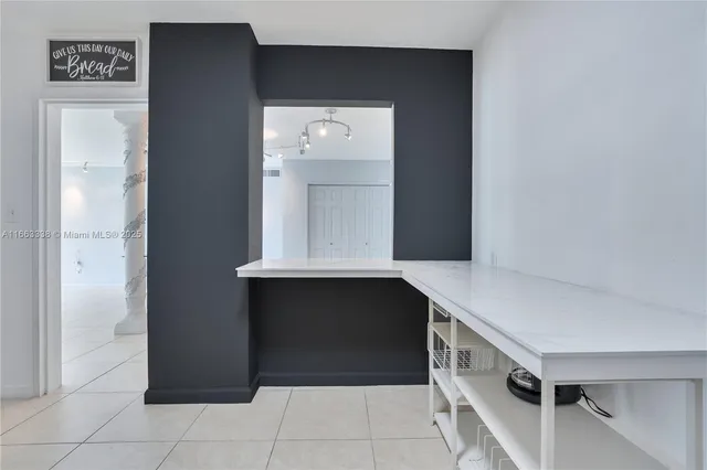 a room with cabinets and wooden floor