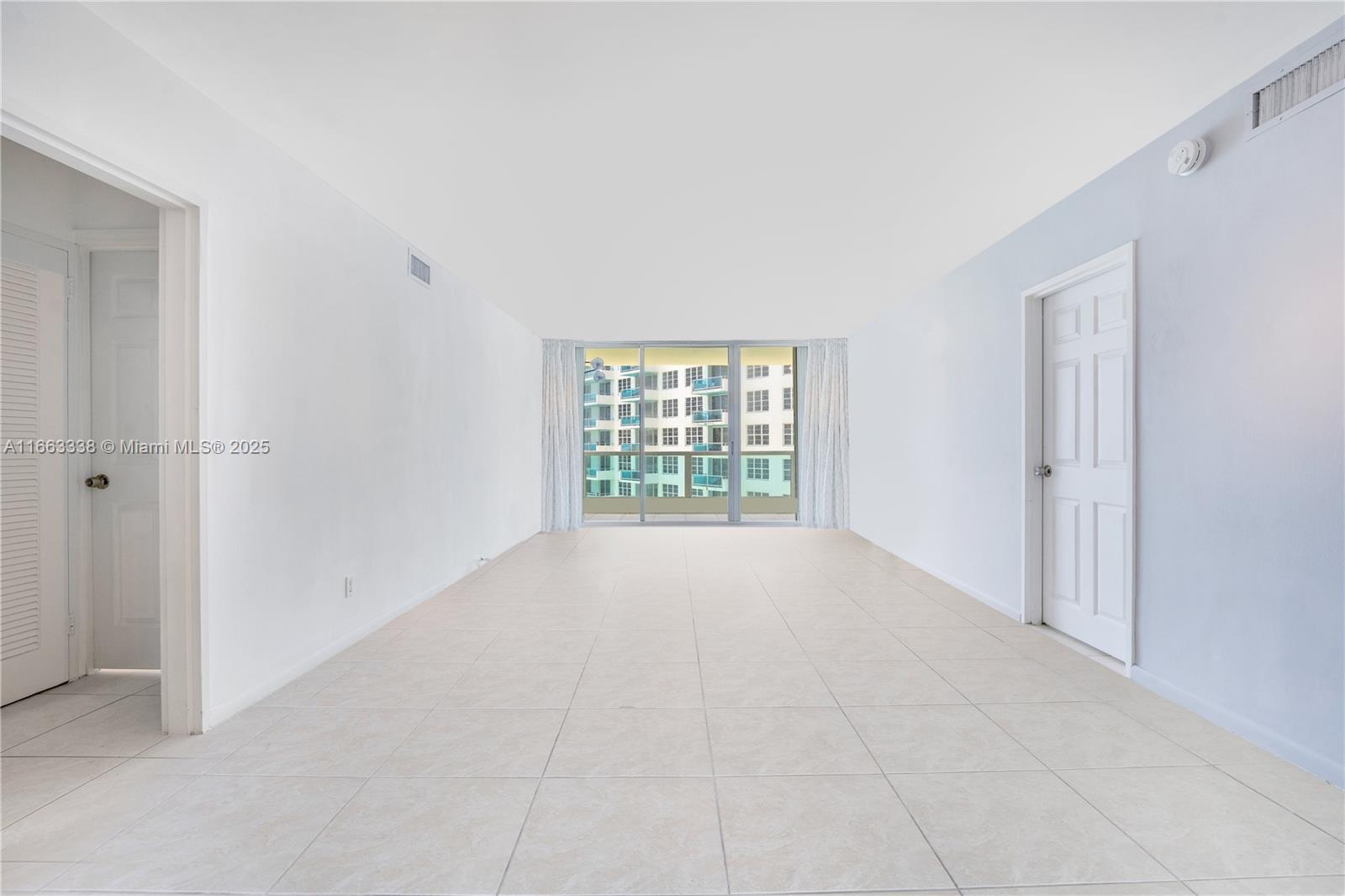 5151 Collins Avenue, Unit 925 Miami Beach, FL 33140 - Photo 4 of 23 a view of an empty room with a window