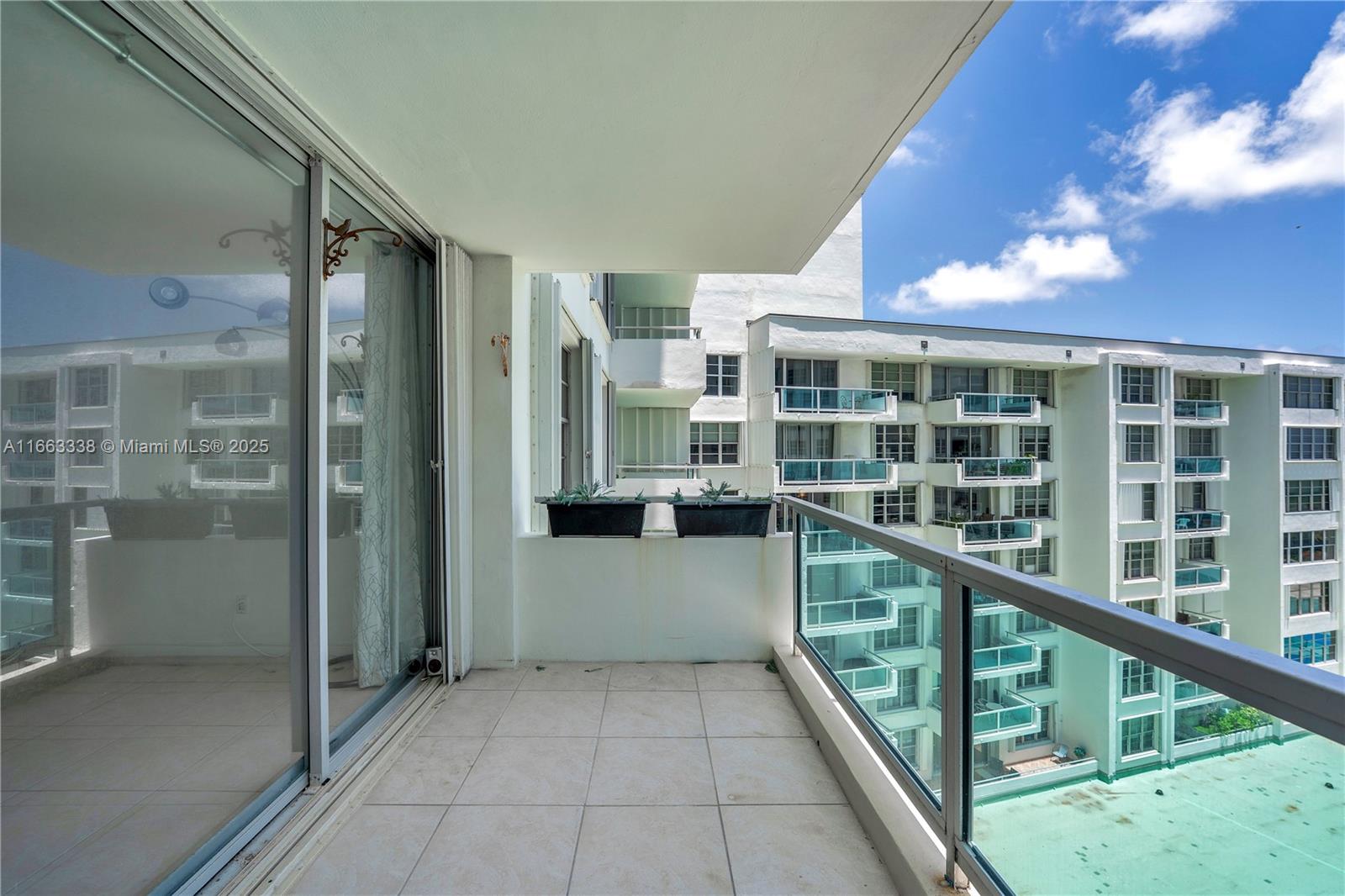 5151 Collins Avenue, Unit 925 Miami Beach, FL 33140 - Photo 6 of 23 a view of balcony with a potted plant