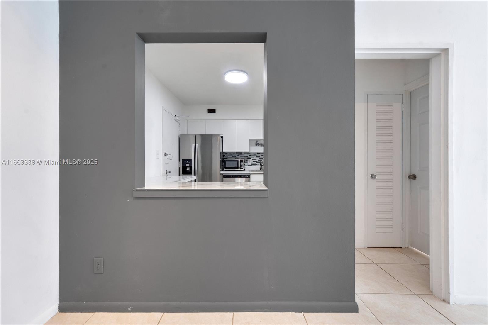 5151 Collins Avenue, Unit 925 Miami Beach, FL 33140 - Photo 9 of 23 a view of kitchen and window