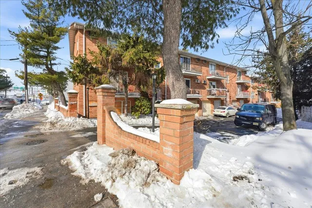 a view of a house with a snow in the yard