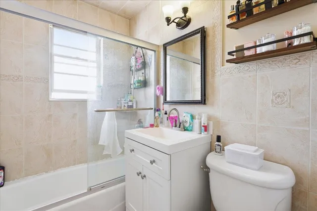 a view of a brick house with large windows