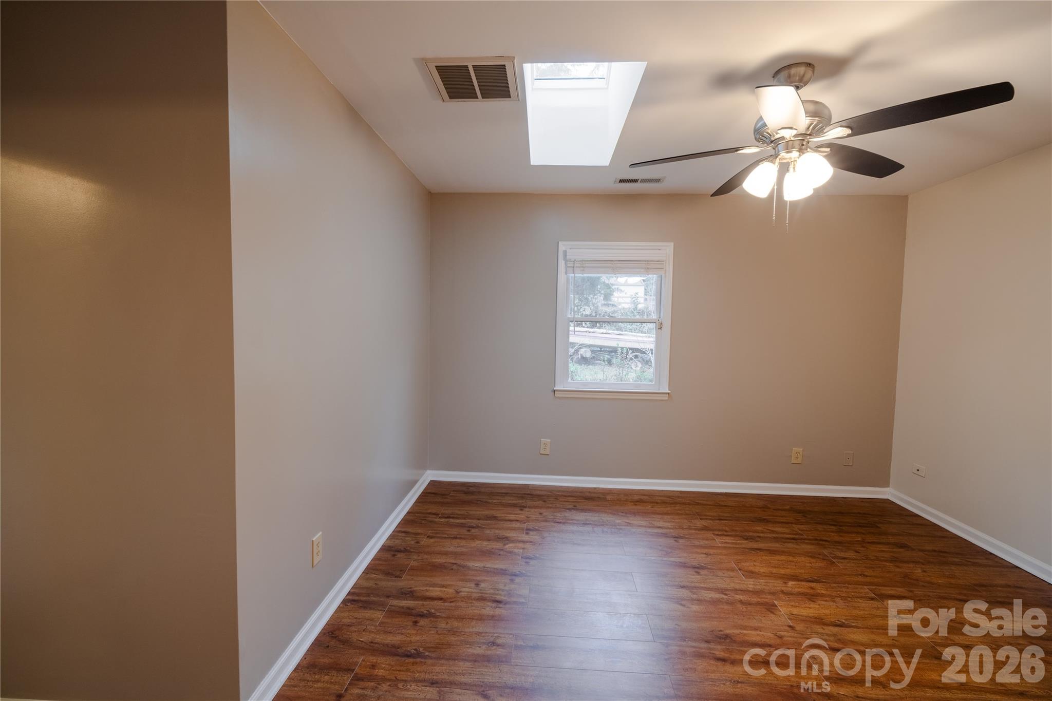 5315 Ruth Drive Charlotte, NC 28215 - Photo 14 of 38 wooden floor in an empty room with a window