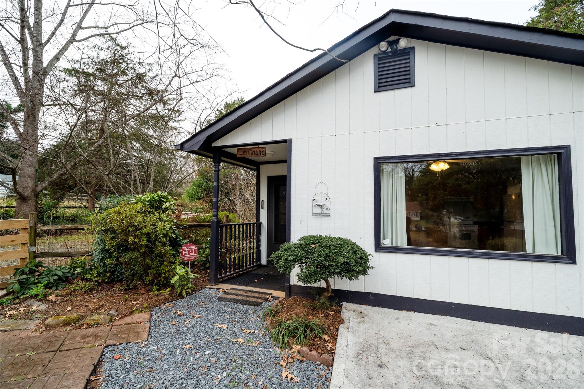 5315 Ruth Drive Charlotte, NC 28215 - Photo 2 of 38 a front view of a house with garden