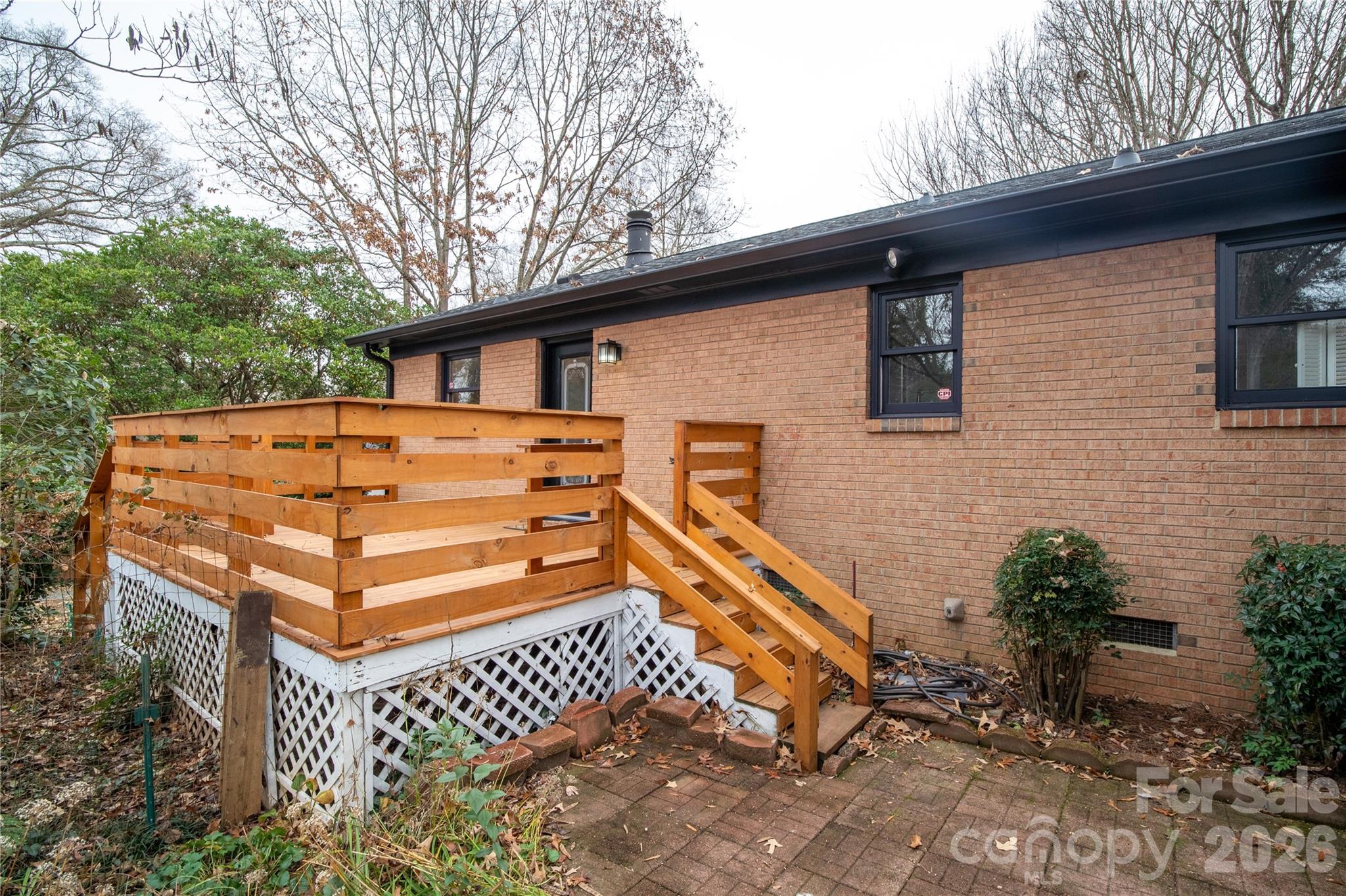 5315 Ruth Drive Charlotte, NC 28215 - Photo 21 of 38 a backyard of a house with wooden deck and furniture