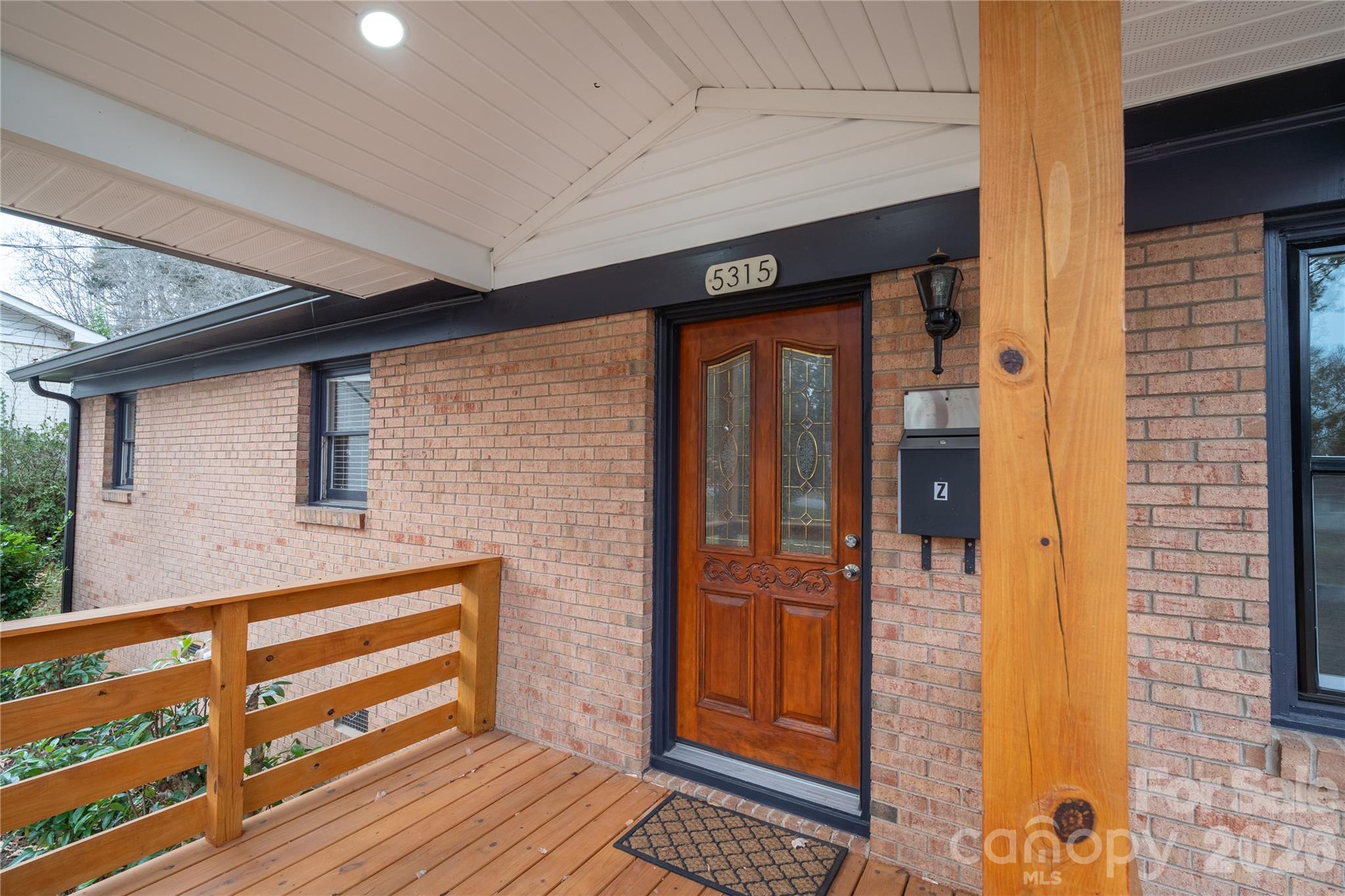 5315 Ruth Drive Charlotte, NC 28215 - Photo 23 of 38 a front view of a house with a glass door