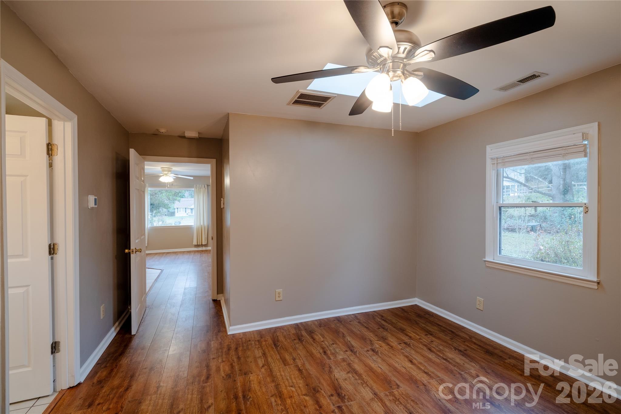 5315 Ruth Drive Charlotte, NC 28215 - Photo 26 of 38 wooden floor in an empty room with a window