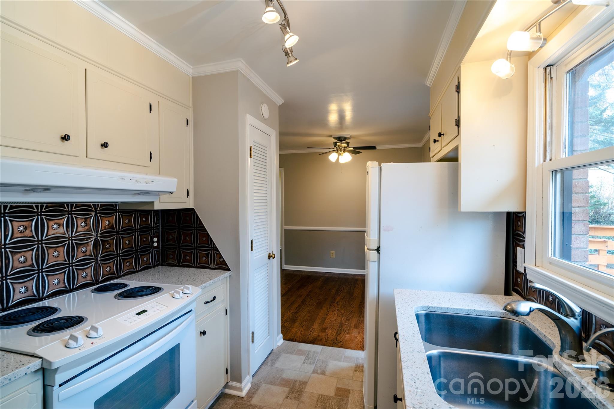 5315 Ruth Drive Charlotte, NC 28215 - Photo 28 of 38 a kitchen with a refrigerator and a sink