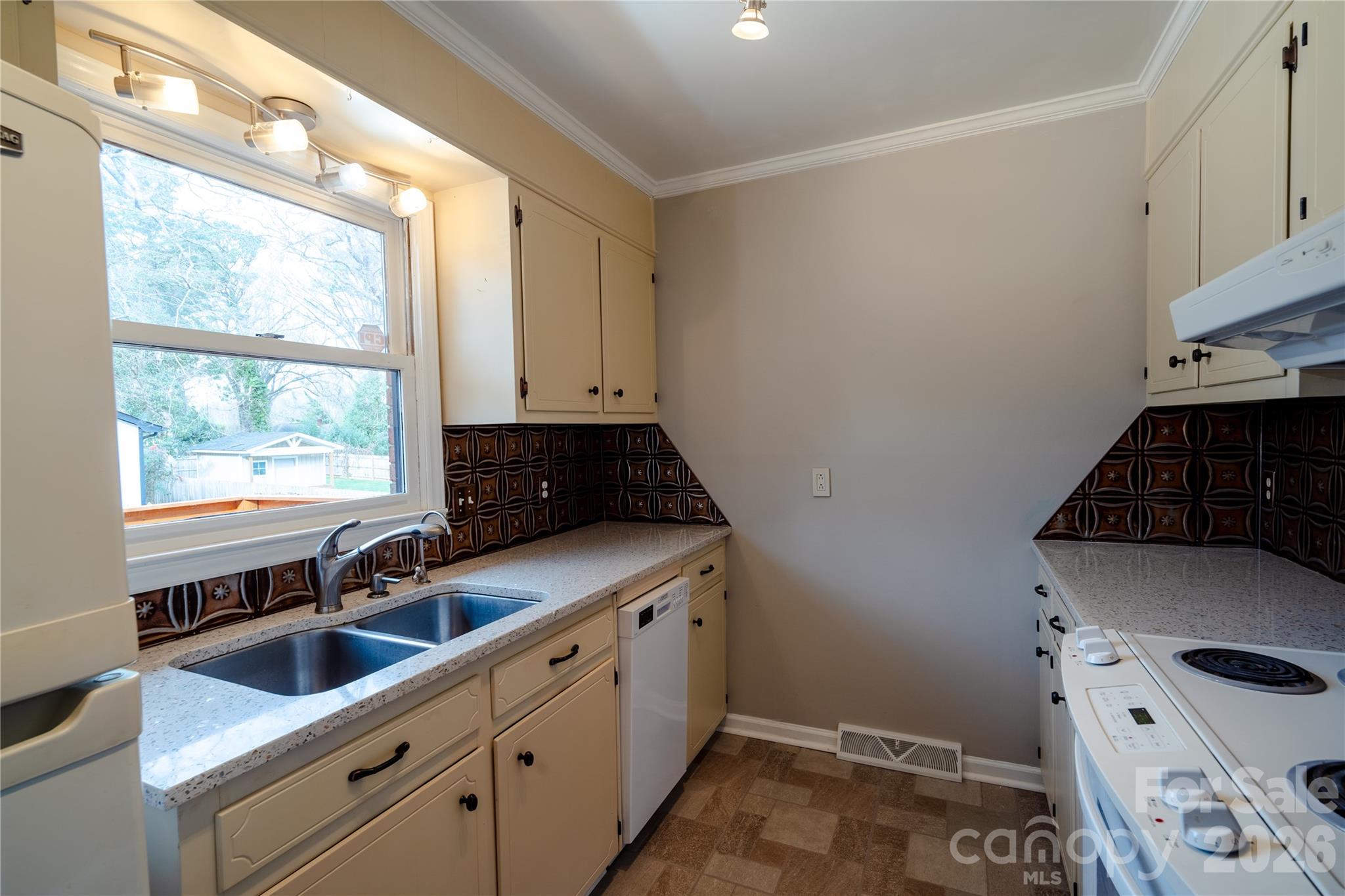 5315 Ruth Drive Charlotte, NC 28215 - Photo 33 of 38 a kitchen that has a sink and a stove