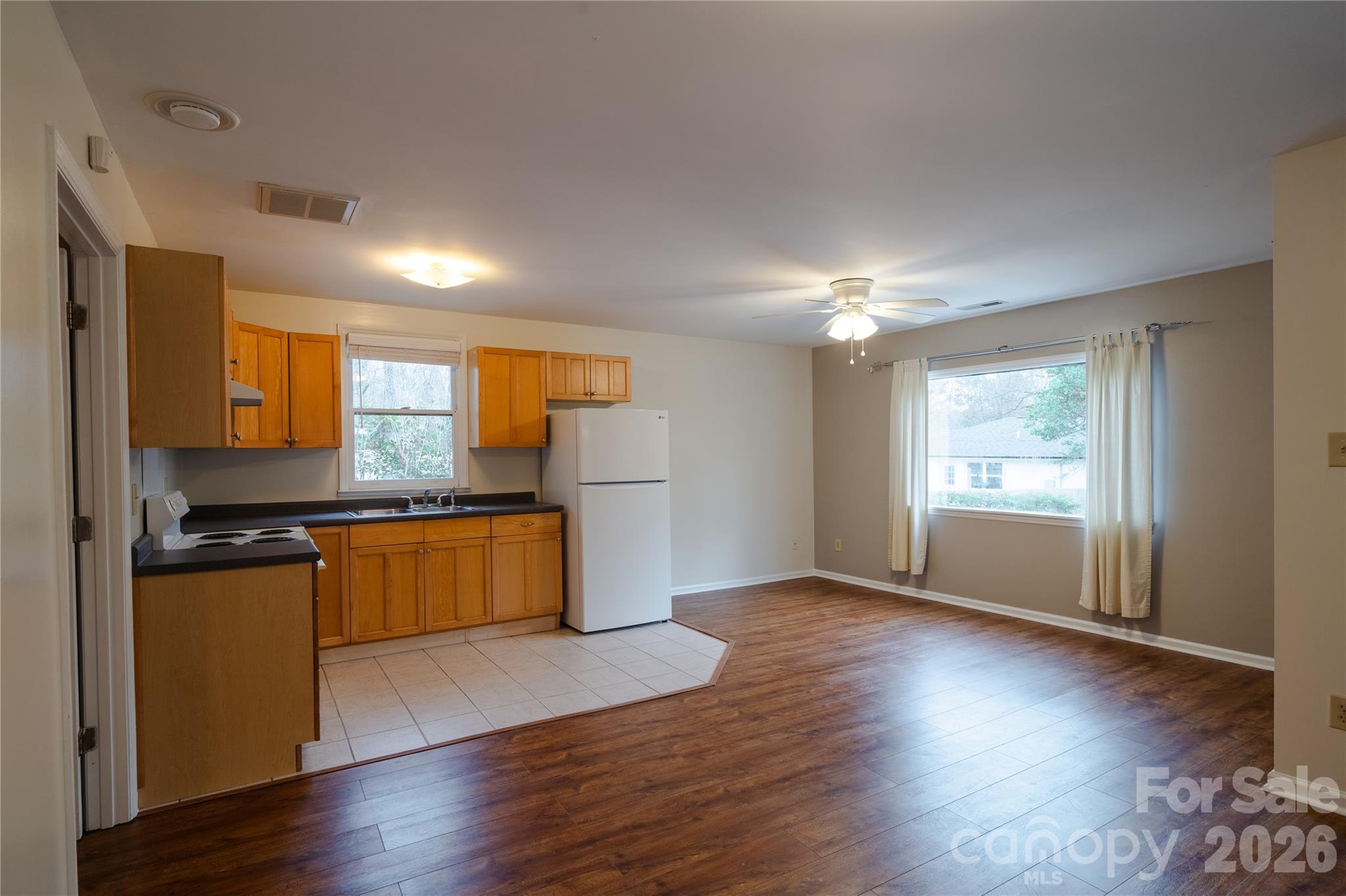 5315 Ruth Drive Charlotte, NC 28215 - Photo 7 of 38 a kitchen with granite countertop a stove and wooden floor