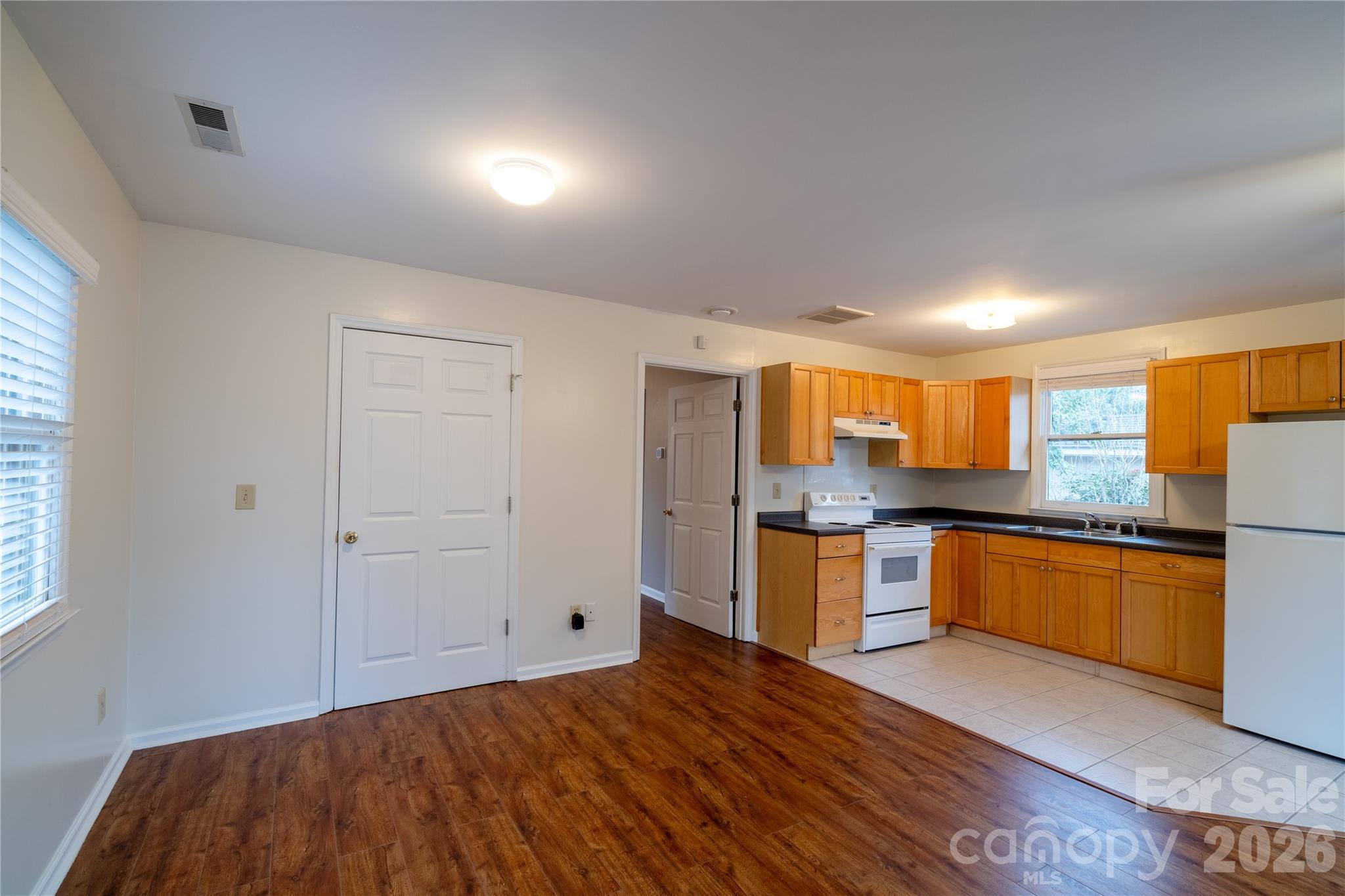 5315 Ruth Drive Charlotte, NC 28215 - Photo 8 of 38 a kitchen with stainless steel appliances granite countertop a stove a sink and a refrigerator