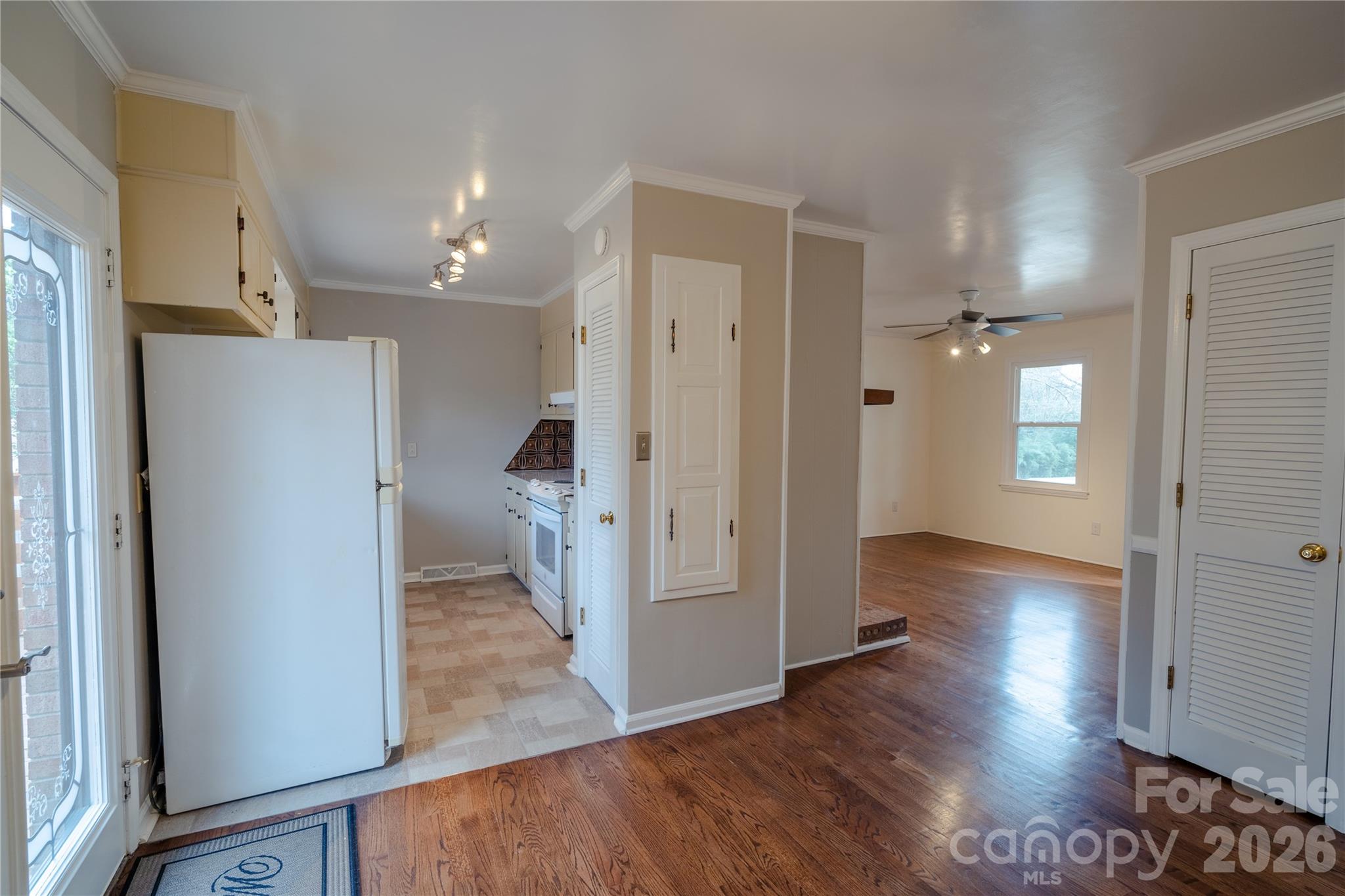 5315 Ruth Drive Charlotte, NC 28215 - Photo 9 of 38 a view of a hallway with wooden floor and a bathroom