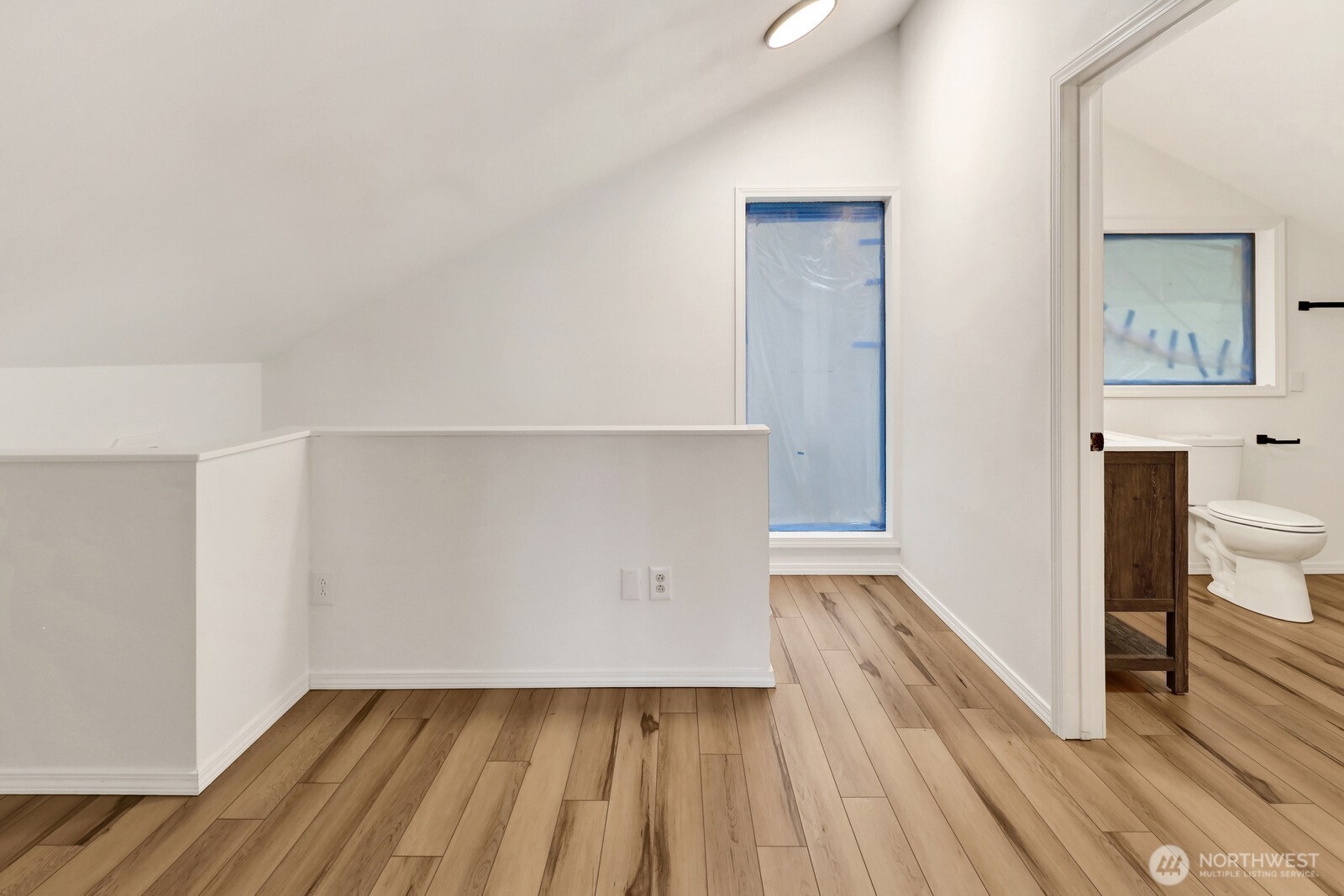 13574 South Green Street Anacortes, WA 98221 - Photo 23 of 26 a view of a room with wooden floor and a bathroom