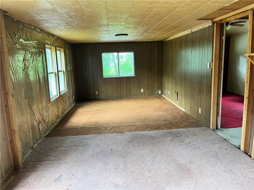 2302 Hunter Road Greensburg, PA 15601 - Photo 4 of 8 a view of an empty room with wooden floor and a window