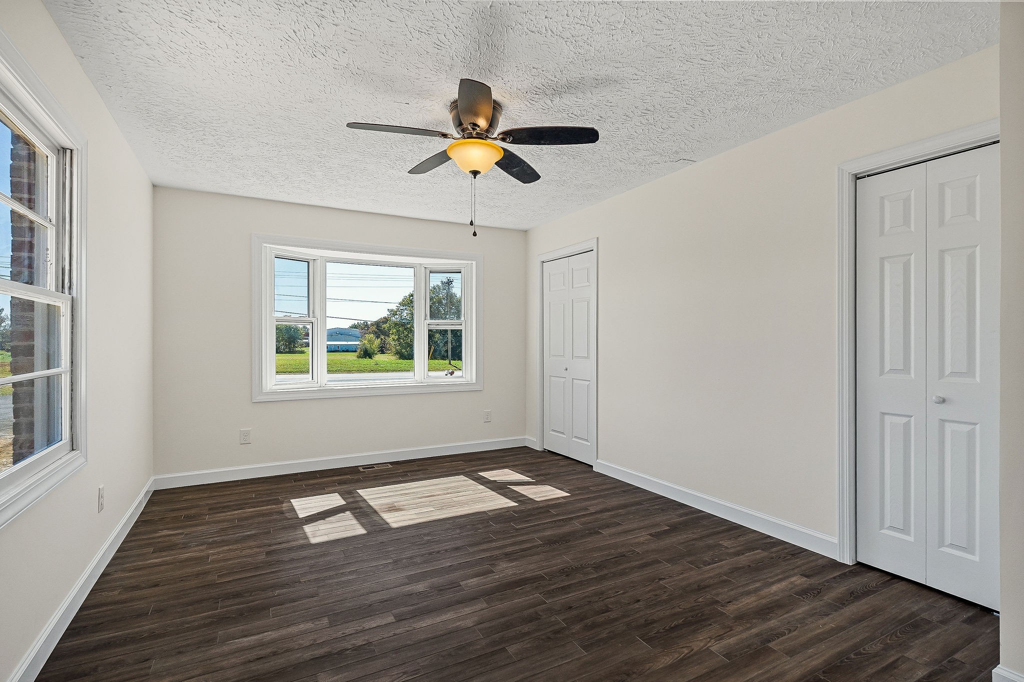 411 Allen Ferry Road Smithville, TN 37166 - Photo 13 of 37 a view of empty room with wooden floor and fan
