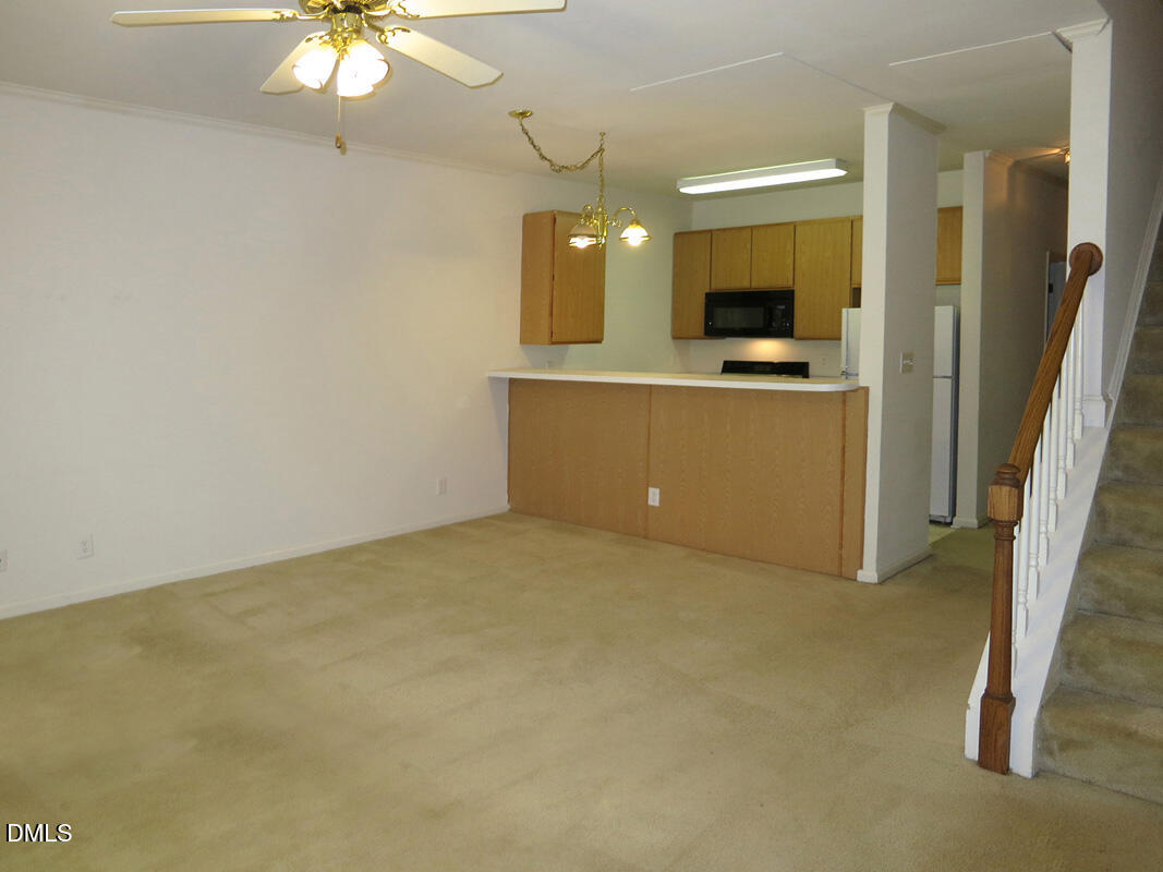 101 Rock Haven Road, Unit E502 Carrboro, NC 27510 - Photo 5 of 16 a view of a kitchen with a sink