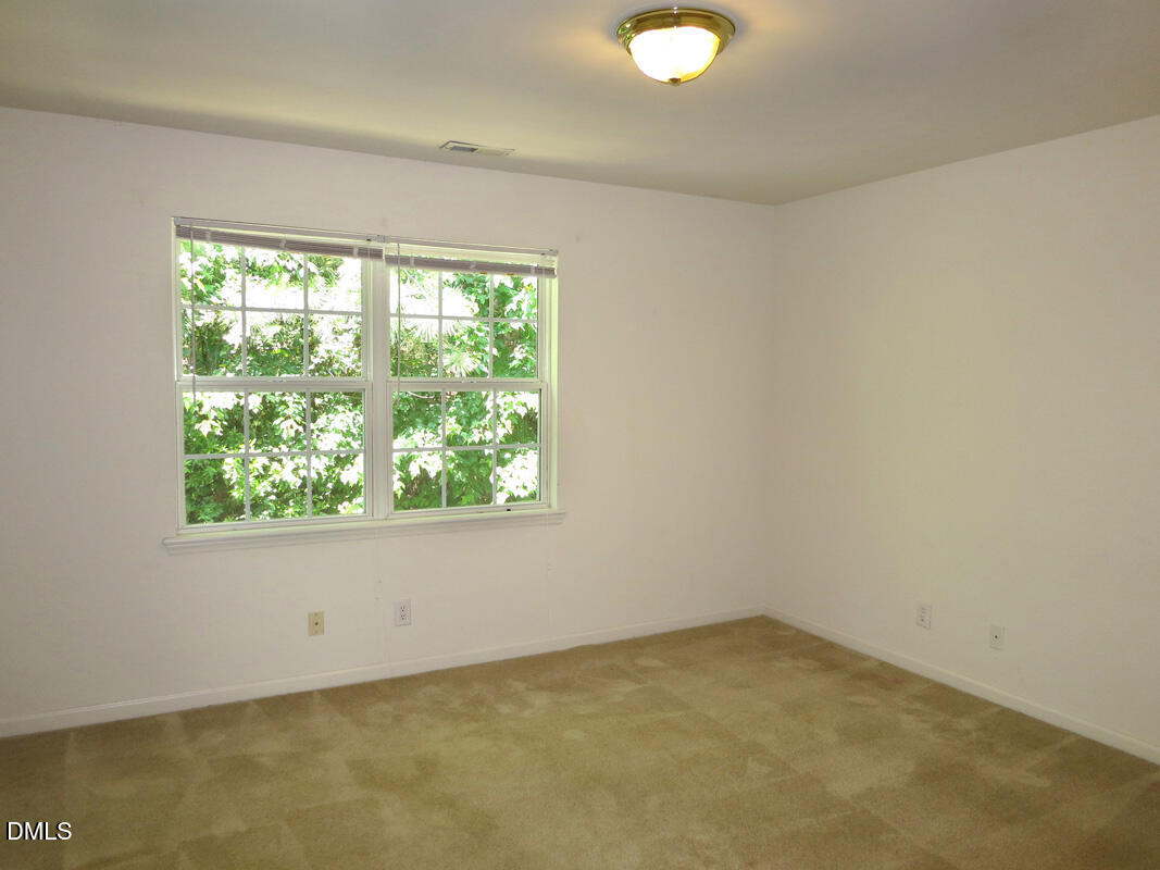101 Rock Haven Road, Unit E502 Carrboro, NC 27510 - Photo 9 of 16 an empty room with a window