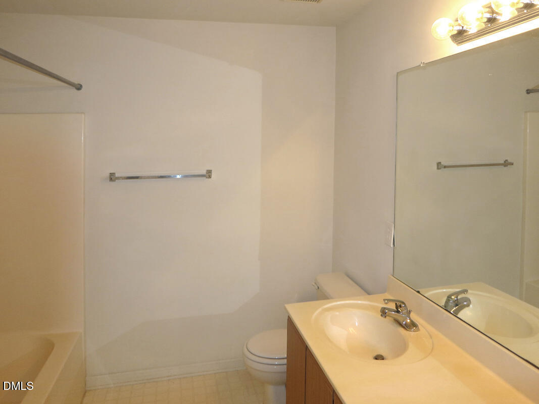 101 Rock Haven Road, Unit E502 Carrboro, NC 27510 - Photo 10 of 16 a bathroom with a sink and toilet