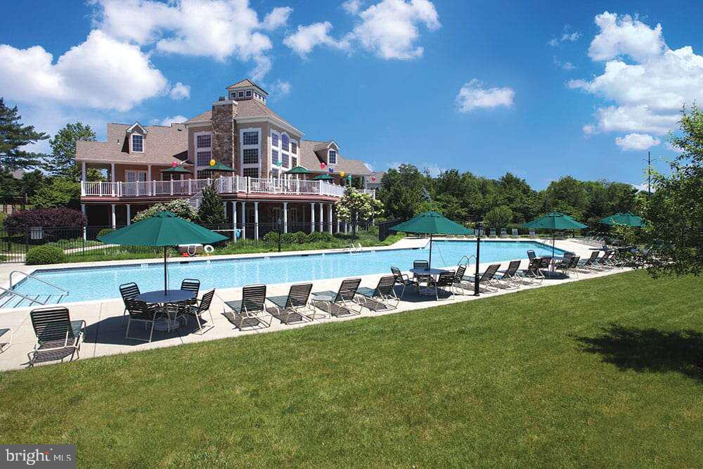 209 Blueberry Court Perkasie, PA 18944 - Photo 20 of 23 a view of a big room with table and chairs and a yard