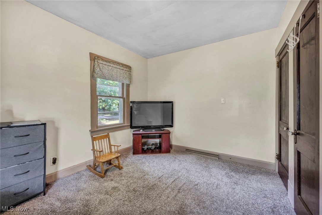 1425 Keefer Road Girard, OH 44420 - Photo 17 of 37 Sitting room with carpet floors and baseboards