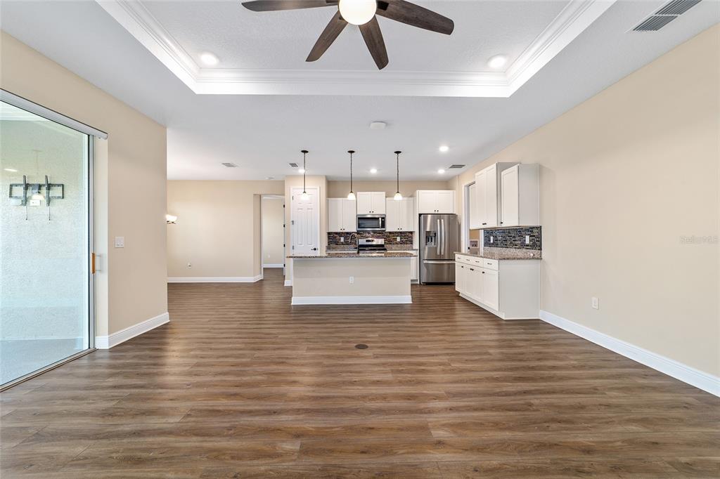 9778 Southwest 103rd Avenue Ocala, FL 34481 - Photo 13 of 57 a view of kitchen with wooden floor
