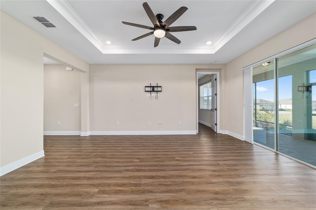 9778 Southwest 103rd Avenue Ocala, FL 34481 - Photo 17 of 57 a view of an empty room with window and wooden floor