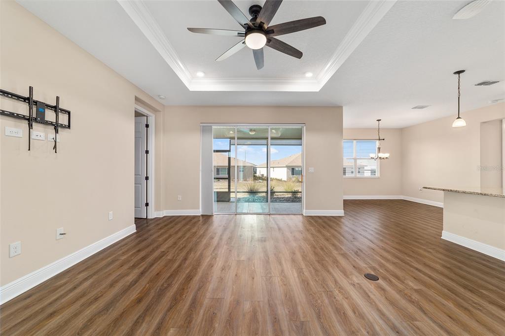9778 Southwest 103rd Avenue Ocala, FL 34481 - Photo 19 of 57 a view of an empty room with window and wooden floor