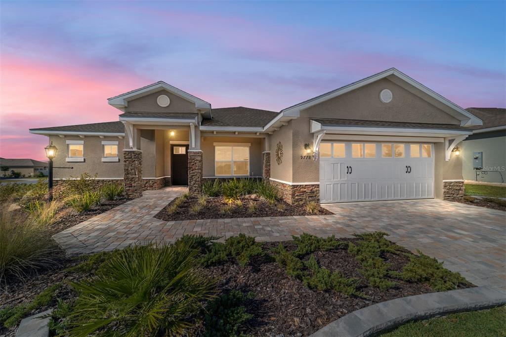 9778 Southwest 103rd Avenue Ocala, FL 34481 - Photo 2 of 57 a front view of a house with garden