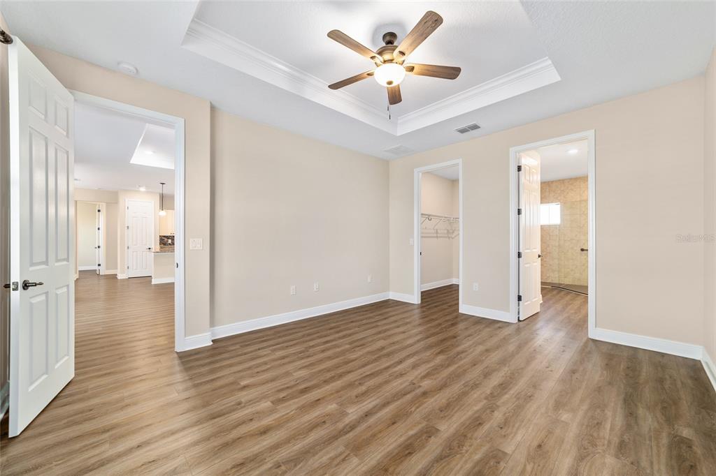 9778 Southwest 103rd Avenue Ocala, FL 34481 - Photo 32 of 57 a view of an empty room and wooden floor