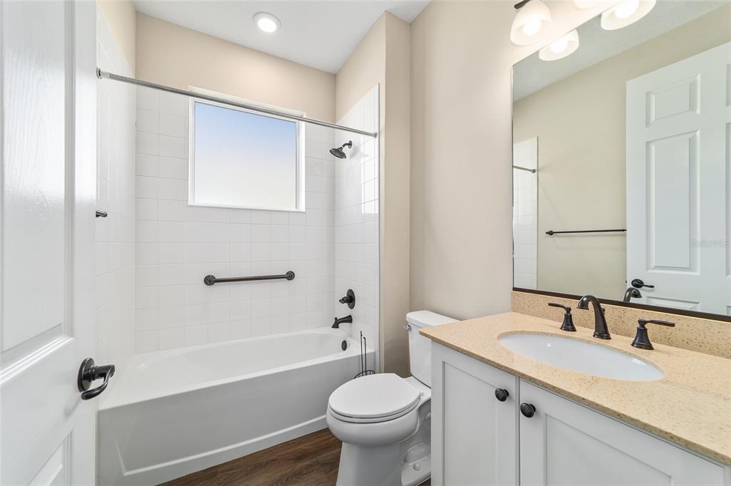 9778 Southwest 103rd Avenue Ocala, FL 34481 - Photo 44 of 57 a bathroom with a granite countertop sink toilet and shower
