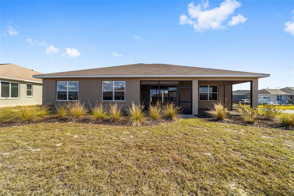 9778 Southwest 103rd Avenue Ocala, FL 34481 - Photo 52 of 57 a front view of house with yard