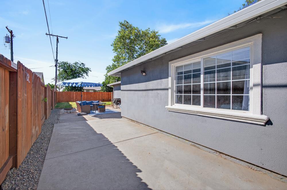 724 Dabney Avenue Rio Linda, CA 95673 - Photo 37 of 53 a view of a house with a floor to ceiling window and potted plants