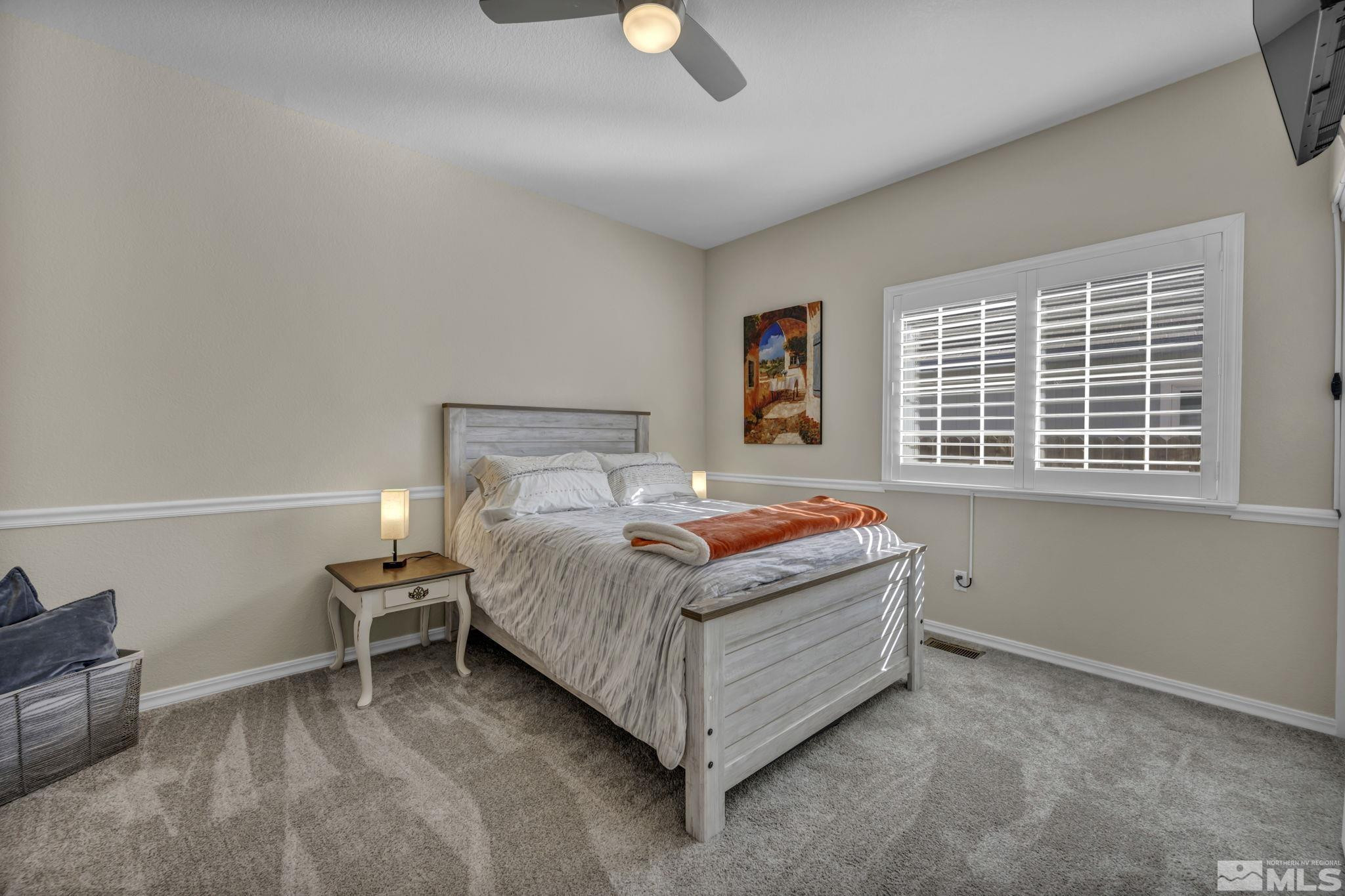 6500 Brookview Circle Reno, NV 89519 - Photo 15 of 24 a bedroom with a bed and a window