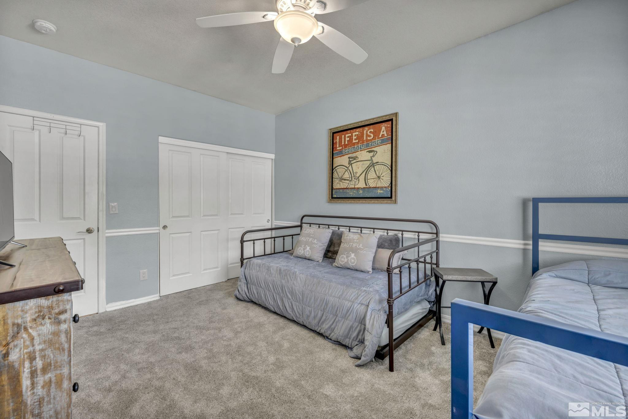 6500 Brookview Circle Reno, NV 89519 - Photo 18 of 24 a bedroom with a bed and a chandelier