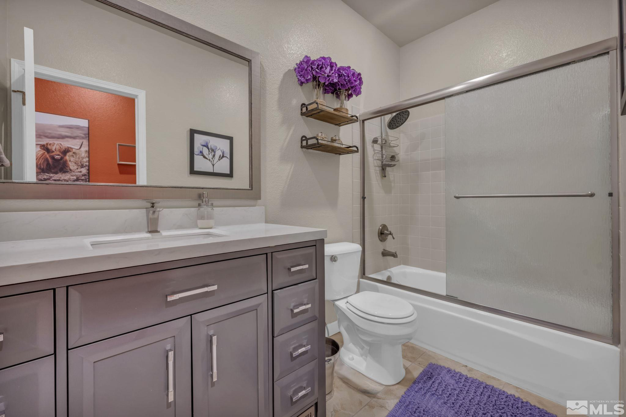6500 Brookview Circle Reno, NV 89519 - Photo 19 of 24 a bathroom with a sink a toilet and shower