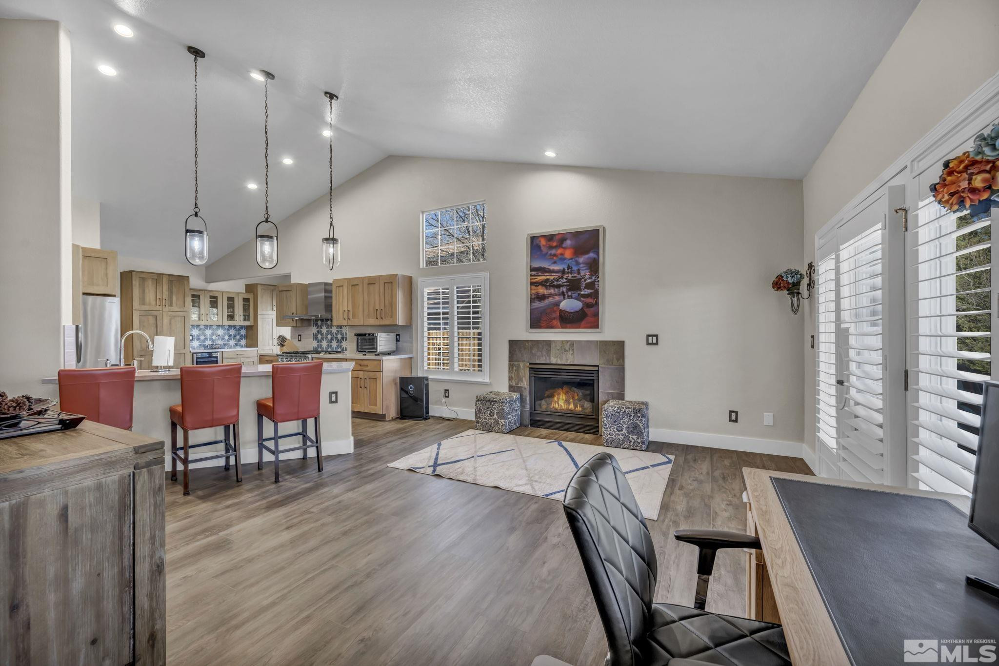 6500 Brookview Circle Reno, NV 89519 - Photo 3 of 24 a living room with fireplace furniture and a wooden floor