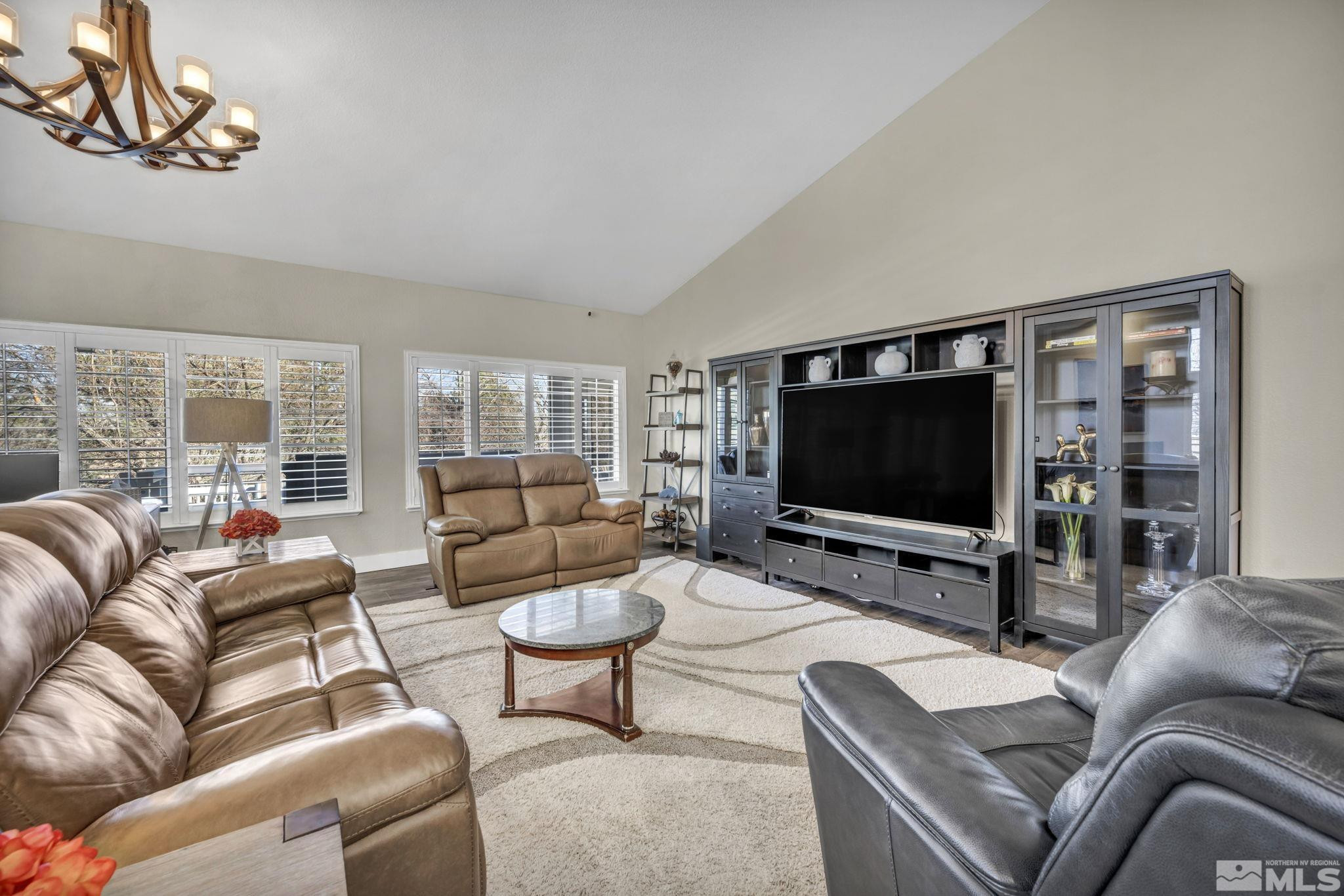 6500 Brookview Circle Reno, NV 89519 - Photo 7 of 24 a living room with furniture and a flat screen tv