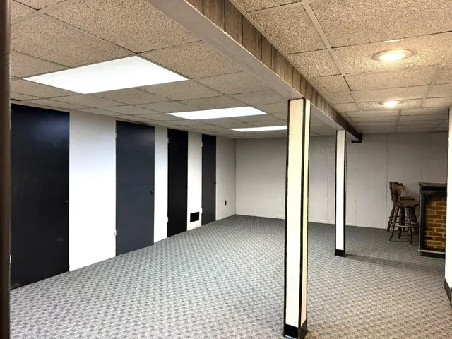 a view of a hallway with wooden shelves