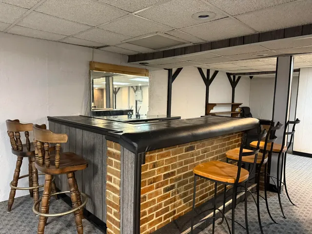 a kitchen with a table and chairs in it