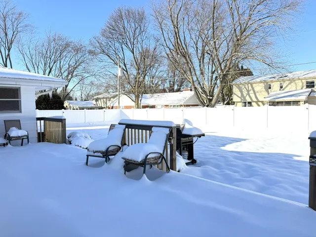a view of a terrace with chairs and a fire pit