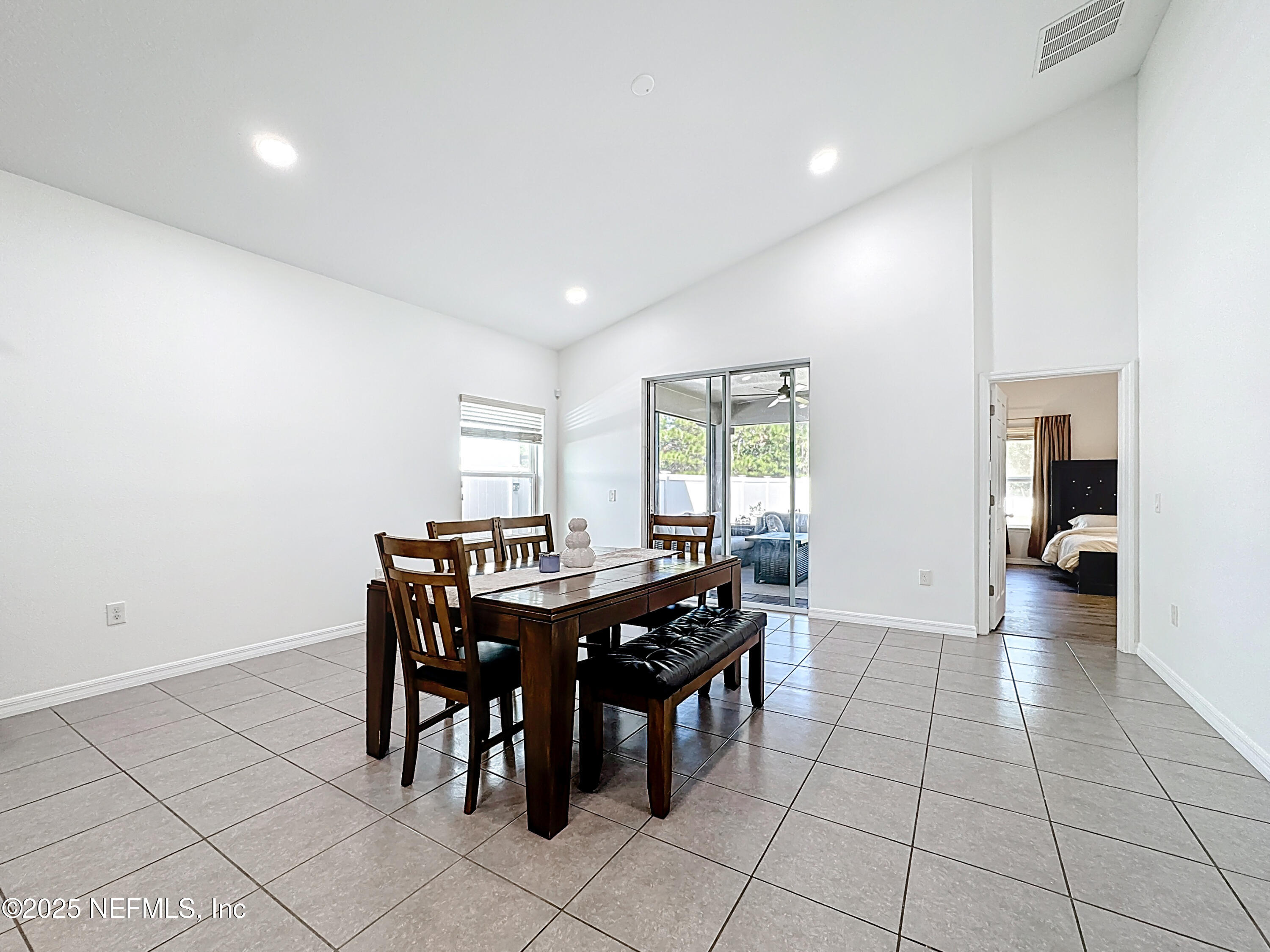 3473 Middlebrook Place St. Cloud, FL 34773 - Photo 12 of 32 a view of a dining room and hall with furniture