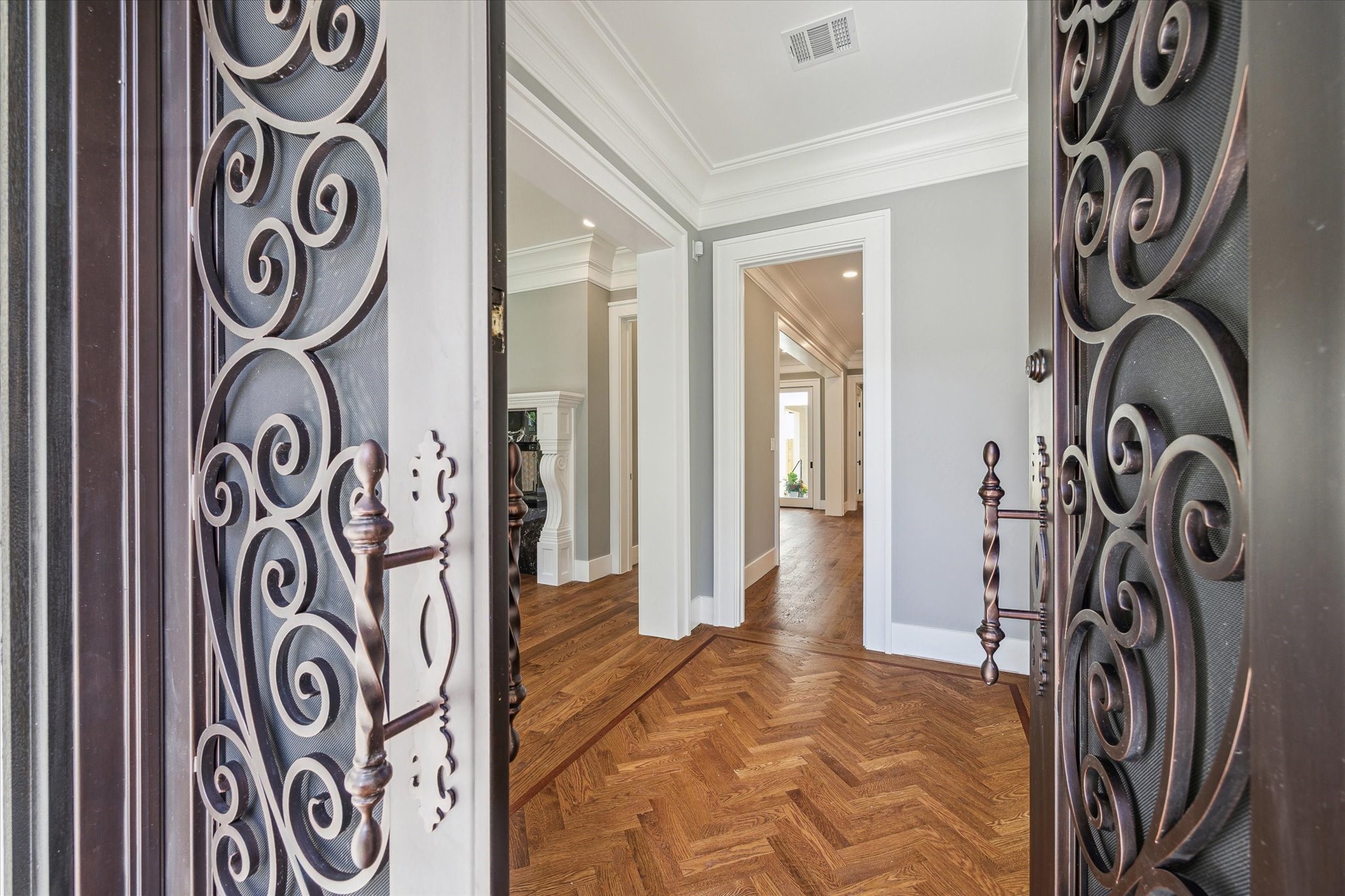 2216 Tangley Street Houston, TX 77005 - Photo 3 of 44 Imagine bringing your friends through these beautiful iron doors onto the herringbone wood flooring in the entry and on into your new home!