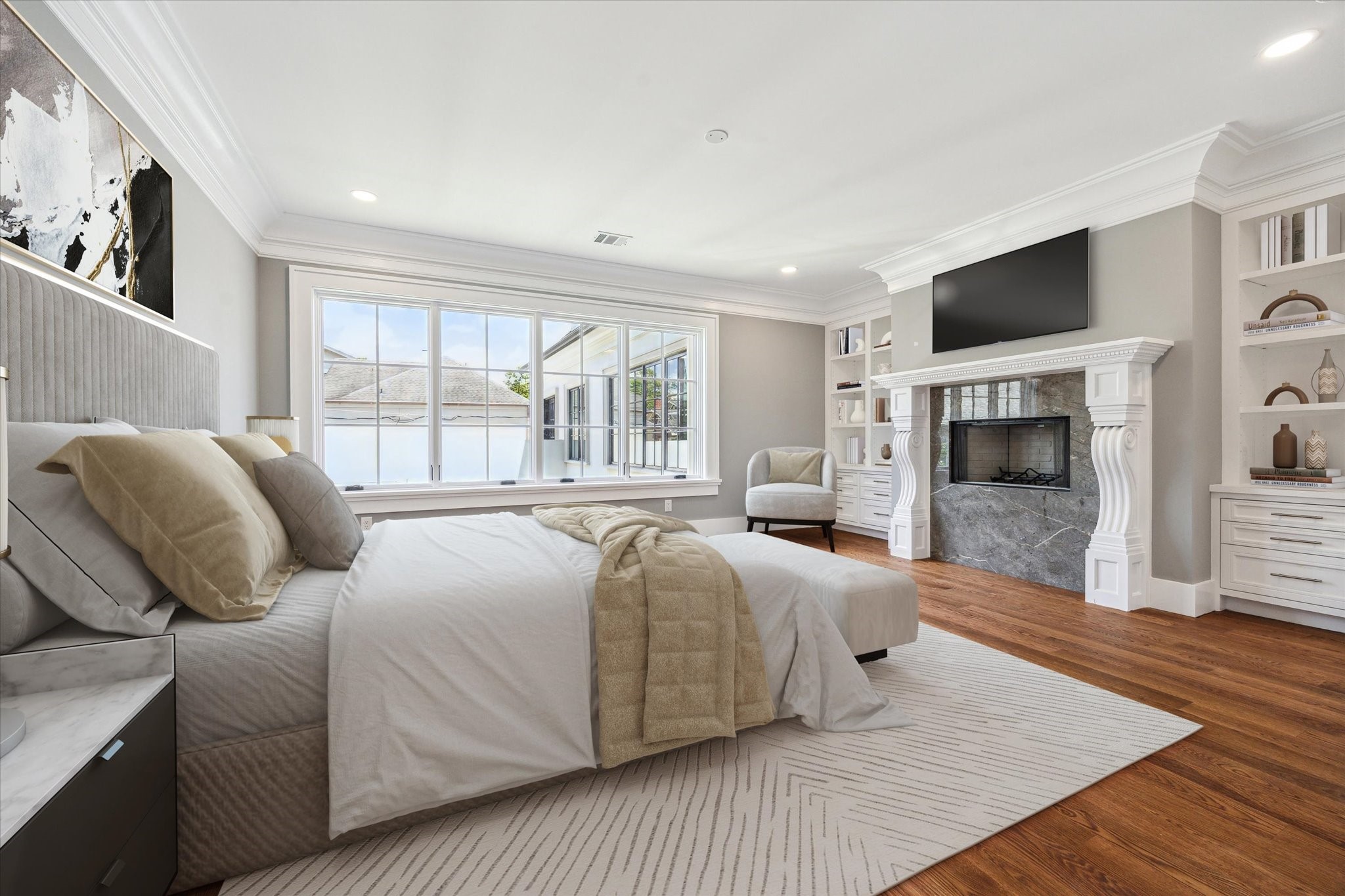 2216 Tangley Street Houston, TX 77005 - Photo 10 of 44 This primary bedroom features large windows for natural light, a cozy fireplace with black marble surround and custom mantle, built-in shelving, and elegant hardwood floors, beautiful crown molding and opens to the luxurious bath and closets. This photo has been virtually staged.