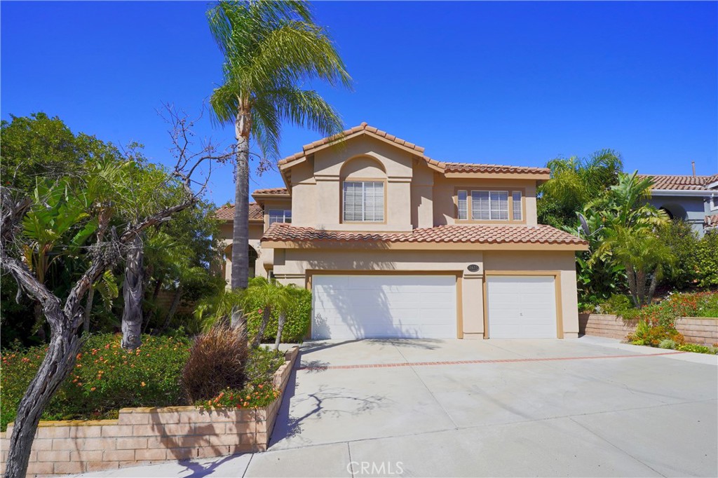 3611 Rio Ranch Road Corona, CA 92882 - Photo 1 of 1 a front view of a house with a yard and garage