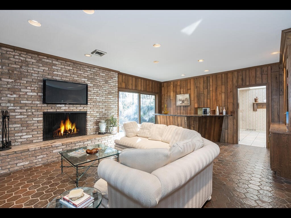 321 Ardsley Road Longmeadow, MA 01106 - Photo 19 of 42 a living room with furniture and a fireplace