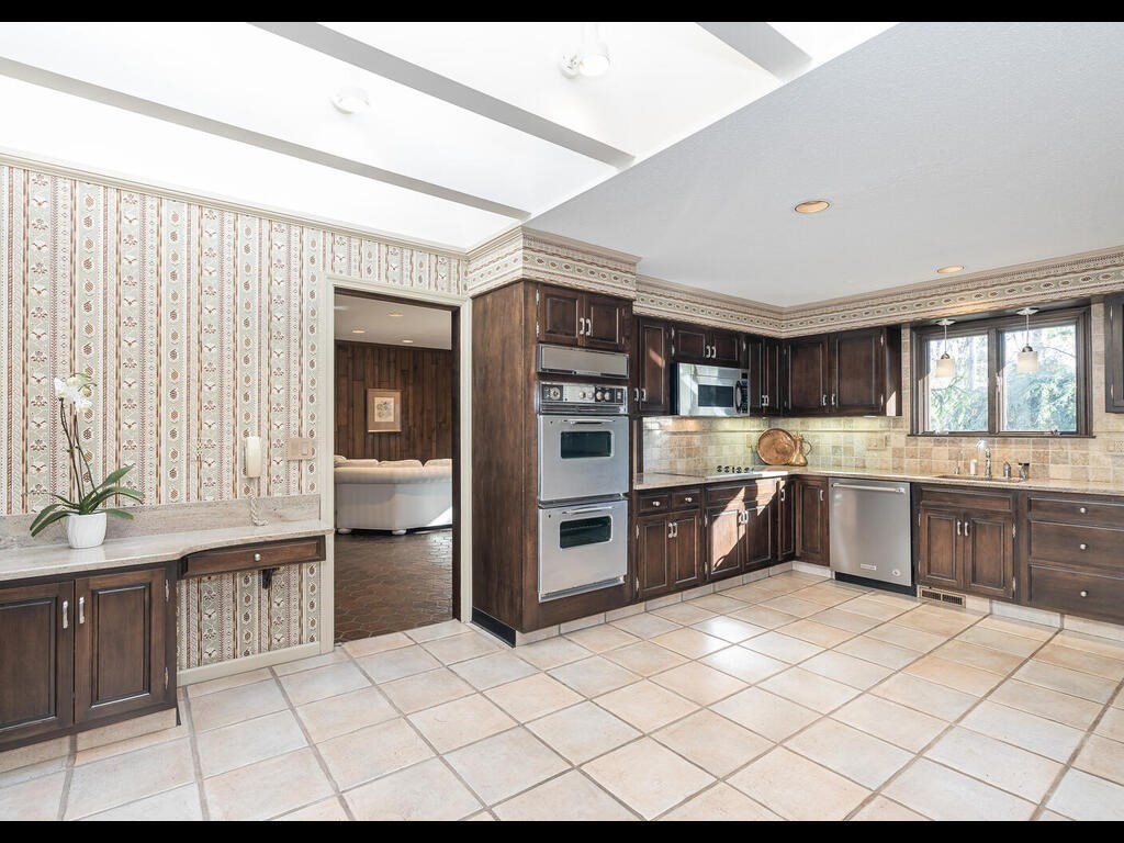 321 Ardsley Road Longmeadow, MA 01106 - Photo 22 of 42 a large kitchen with stainless steel appliances kitchen island granite countertop a refrigerator and a stove top oven