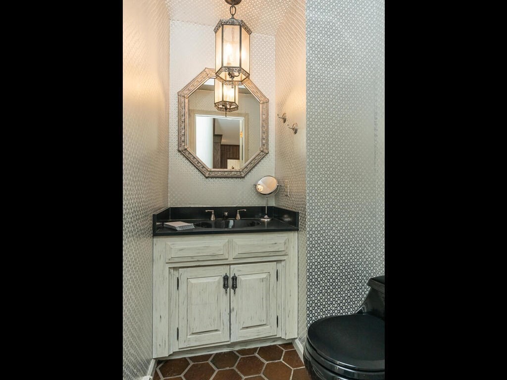 321 Ardsley Road Longmeadow, MA 01106 - Photo 26 of 42 a bathroom with a granite countertop sink a toilet and a mirror
